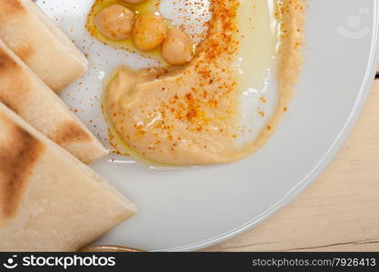 traditional chickpeas Hummus with pita bread and paprika on top