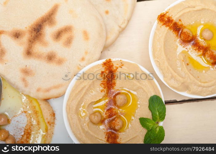 traditional chickpeas Hummus with pita bread and paprika on top