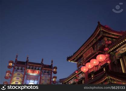 Traditional Chinese buildings illuminated at night in Beijing, China