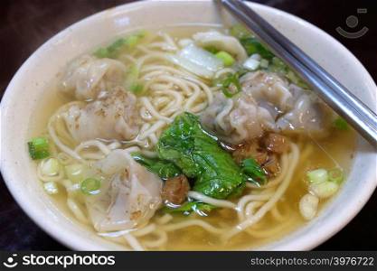 Traditional chinese food, noodle soup with dumpling.
