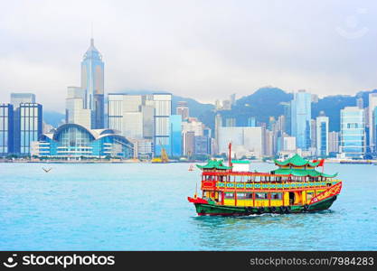 Traditional chinese-style boat sailing in Hong Kong harbor