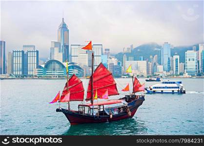 Traditional chinese-style sailboat sailing in Hong Kong harbor