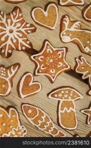 Traditional Christmas treat. Tasty gingerbread cookies on wooden background. Homemade Christmas cookies. Christmas homemade gingerbread cookies