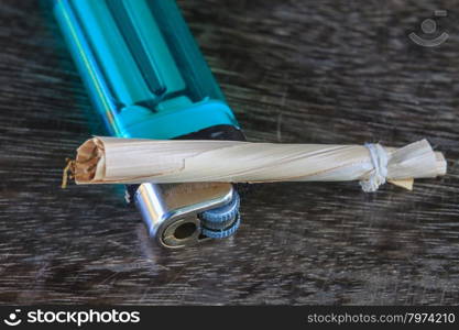Traditional cigarettes and tobacco isolated on wooden background