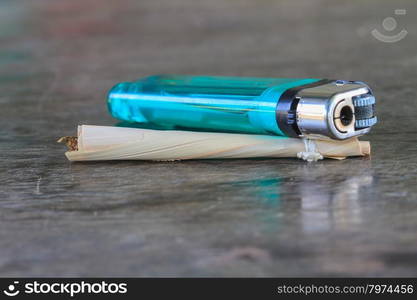 Traditional cigarettes and tobacco isolated on wooden background