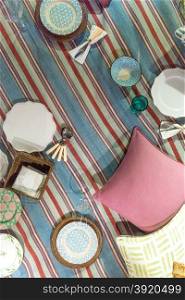 Traditional Classic Picnic Blanket Scene Set out with plates, cushions and cutlery