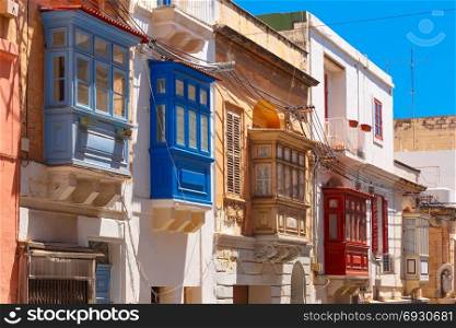 Traditional colorful wooden balconies, Malta. The traditional Maltese colorful wooden balconies in Sliema, Malta