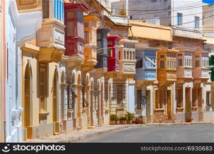 Traditional colorful wooden balconies, Malta. The traditional Maltese colorful wooden balconies in Sliema, Malta