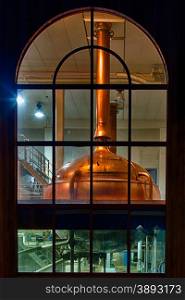 Traditional copper distillery tanks in a beer brewery