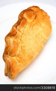 Traditional Cornish pasty; filled with meat, onion and potato, these have become a favourite snack across Britain.