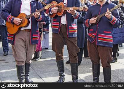 Traditional Croatian musicians in Slavonian costumes play in the city square