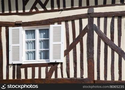 Traditional decorative flowers on around house in Normandy, France