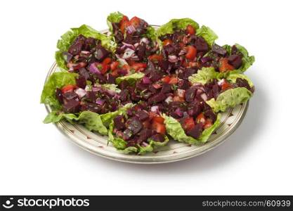 Traditional dish with Moroccan beet salad on white background