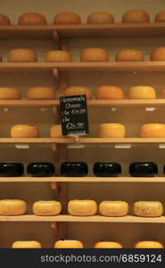 Traditional Dutch cheeses on display in a store