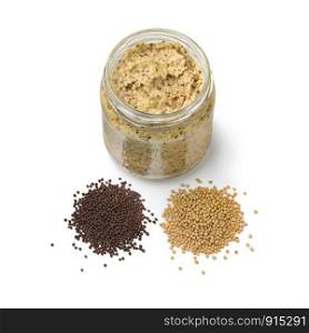 Traditional Dutch mustard with a heap of yellow and brown mustard seed isolated on white background