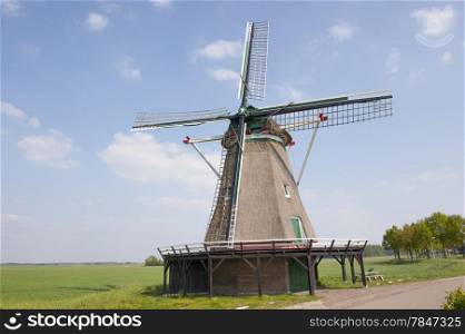 Traditional Dutch straw windmill in the countryside