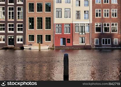 Traditional Dutch style historical row houses on a cana in Amsterdam, Holland, Netherlands.