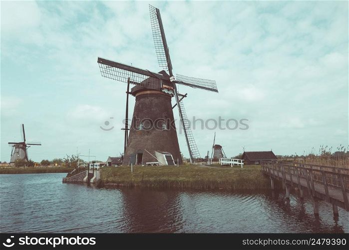 Traditional Dutch windmills in Kinderdijk near Rotterdam in Netherlands vintage color stylized