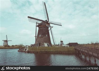 Traditional Dutch windmills in Kinderdijk near Rotterdam in Netherlands vintage color stylized