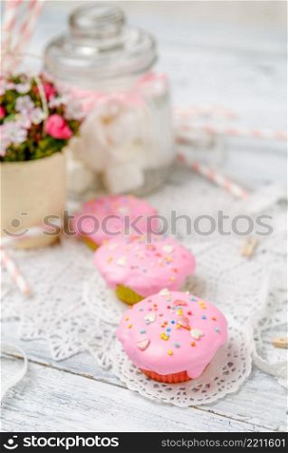 Traditional Easter cupcake with decorations and cupcakes on wooden table. Traditional Easter cupcake and cupcakes