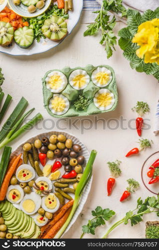 Traditional Easter food . Various eggs meals plates for brunch or breakfast on white table background. Top view