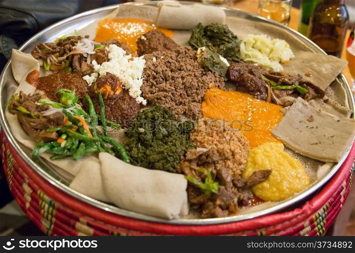 Traditional Ethiopian Food, Several types of stew and meat served on Injera