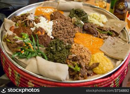 Traditional Ethiopian Food, Several types of stew and meat served on Injera