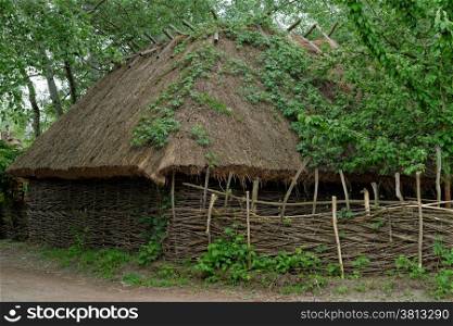 Traditional farmer&rsquo;s barn under the thatch roof in open air museum, Kiev, Ukraine