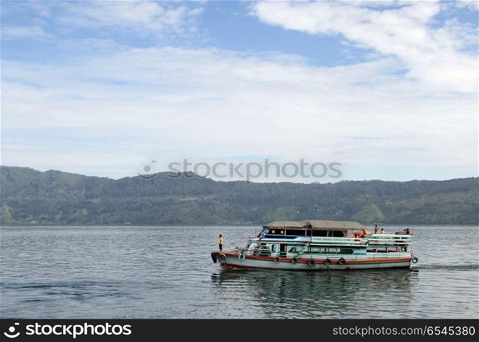 Traditional ferry boat on the lake Samosir in Indonesia