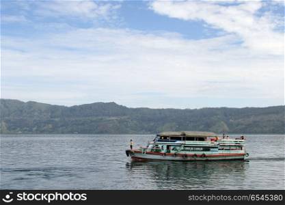 Traditional ferry boat on the lake Samosir in Indonesia
