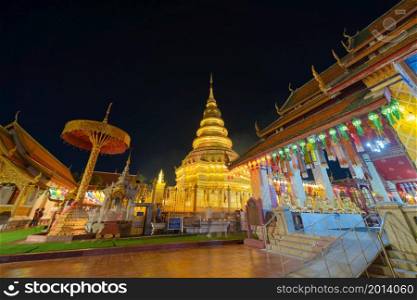 Traditional festival in Harikulchai Temple, Lamphun, Thailand in holidays vacation. Ceremony in Asia. Celebration. Thai architecture. Tourist attraction landmark.