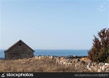 Traditional fishing cabin built of limestone at the swedish island Oland in the Baltic Sea