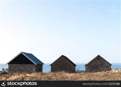 Traditional fishing cabins built of limestone at the swedish island Oland in the Baltic Sea