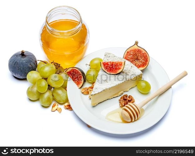 traditional french brie cheese and honey isolated on a white background. traditional french brie cheese and honey on a white background