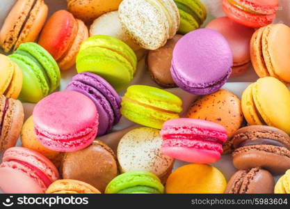 traditional french colorful macarons in a rows in a box