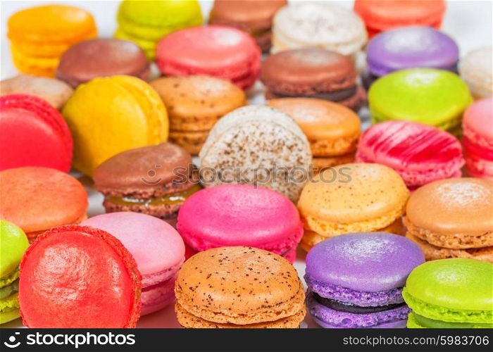 traditional french colorful macarons in a rows in a box