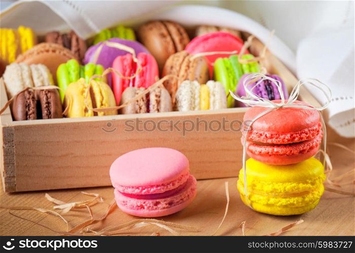 traditional french colorful macarons in a rows in a box