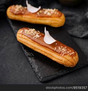 Traditional french dessert. eclair with caramel