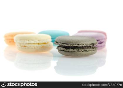 traditional french macaroons over white with reflection