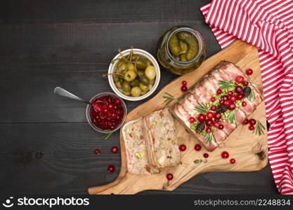 Traditional French terrine covered with bacon and Christmas decoration on dark wooden background. High quality photo. Traditional French terrine covered with bacon on dark wooden background