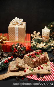 Traditional French terrine covered with bacon on dark wooden background with Christmas decorations. High quality photo. Traditional French terrine covered with bacon on dark wooden background with Christmas decorations