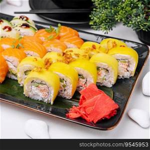Traditional fresh japanese sushi rolls on stone plate