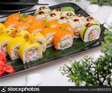 Traditional fresh japanese sushi rolls on stone plate