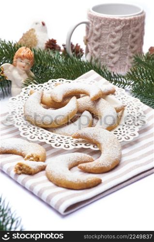 Traditional German or Austrian Vanillekipferl vanilla kipferl cookies and Chistmas decorations. High quality photo. Traditional German or Austrian Vanillekipferl vanilla kipferl cookies and Chistmas decorations