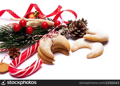 Traditional German or Austrian Vanillekipferl vanilla kipferl cookies and Christmas decorations. High quality photo. Traditional German or Austrian Vanillekipferl vanilla kipferl cookies and Christmas decorations