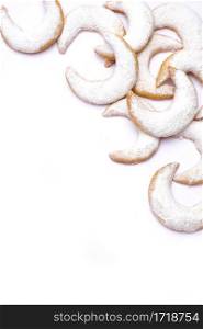 Traditional German or Austrian Vanillekipferl vanilla kipferl cookies isolated on white background. High quality photo. Traditional German or Austrian Vanillekipferl vanilla kipferl cookies isolated on white background