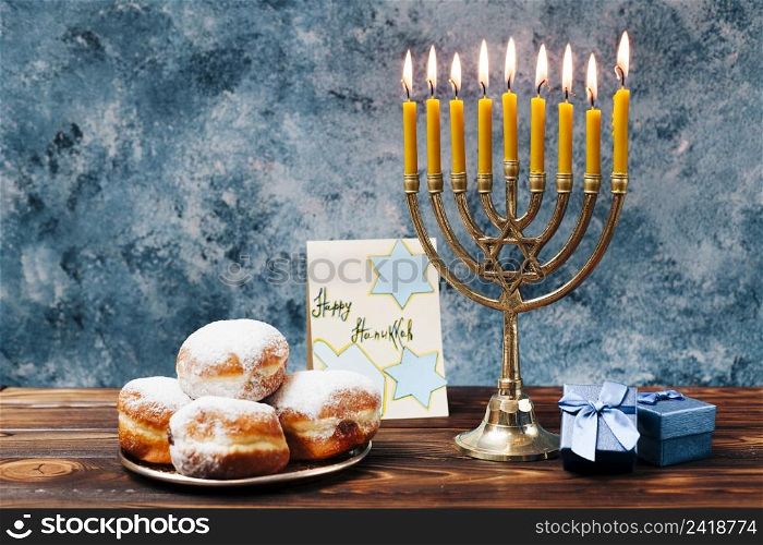 traditional hanukkah sweets with candles