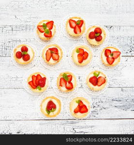 Traditional homemade strawberry cake on wooden background. Homemade Strawberry cake