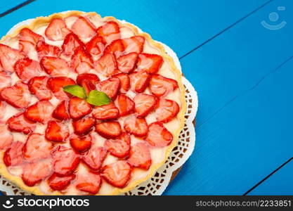 Traditional homemade strawberry cake on wooden background. Homemade Strawberry cake