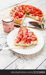 Traditional homemade strawberry cake on wooden background. Homemade Strawberry cake